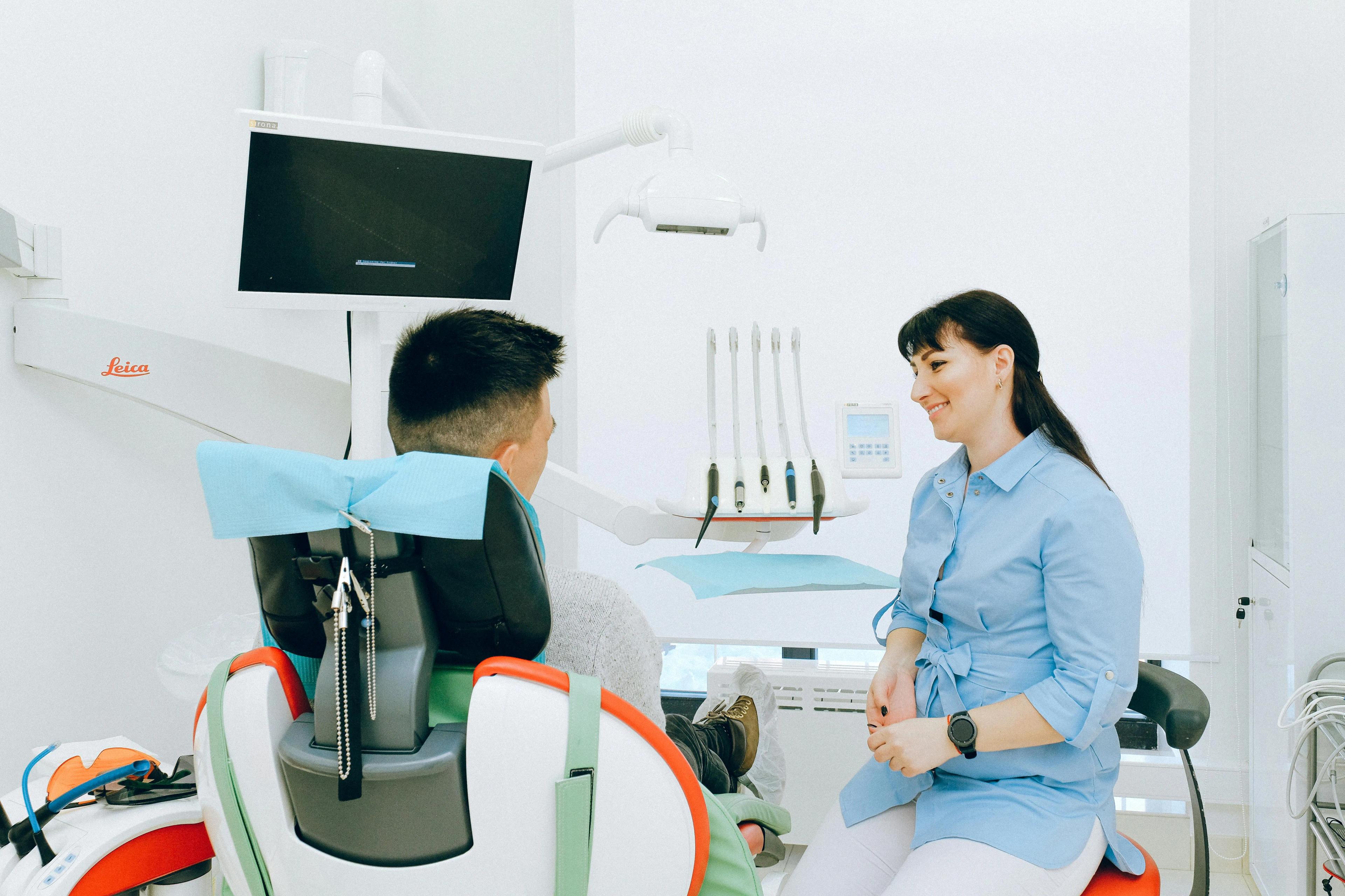 Picture of a dentist with their patient